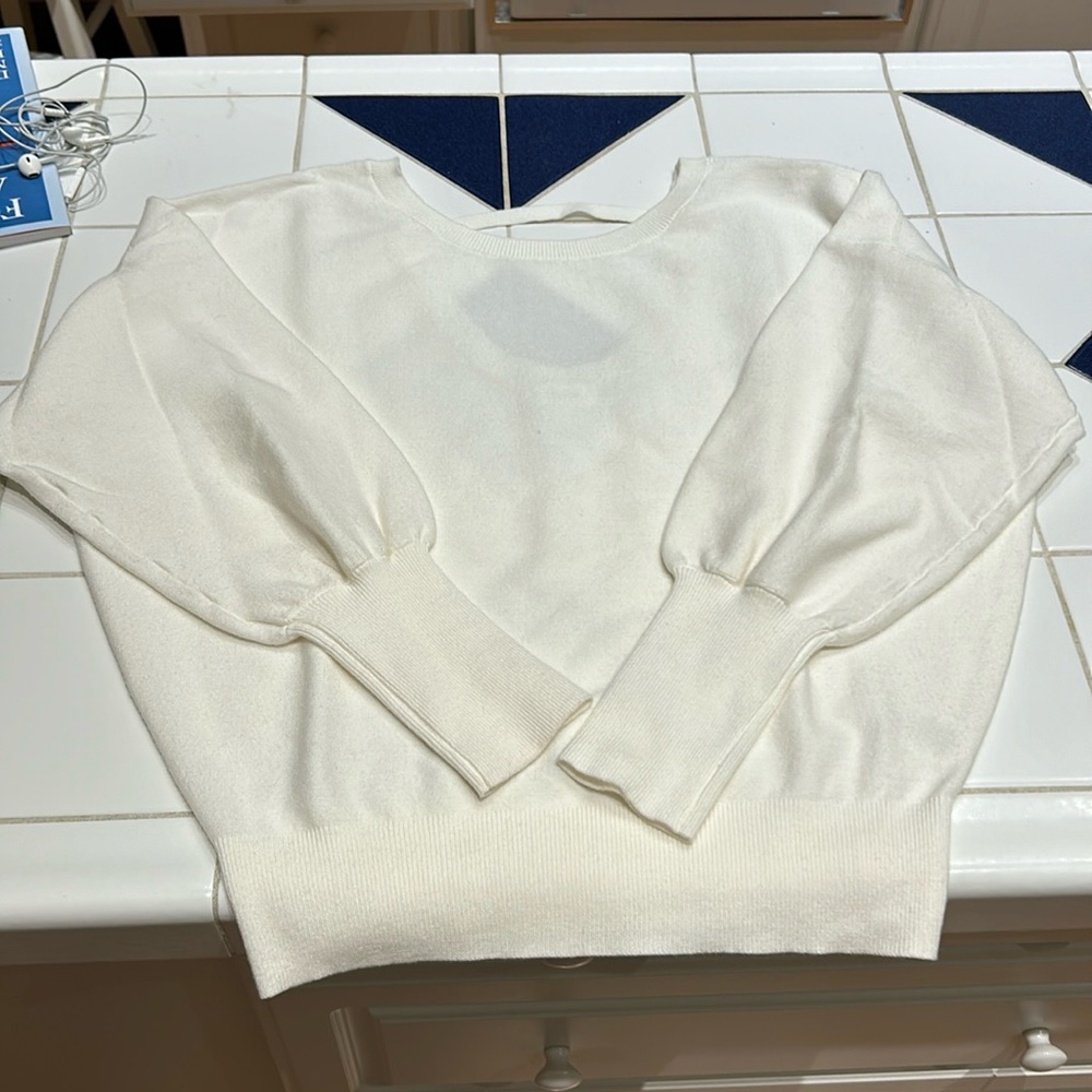 Blue Ivy cream colored sweater